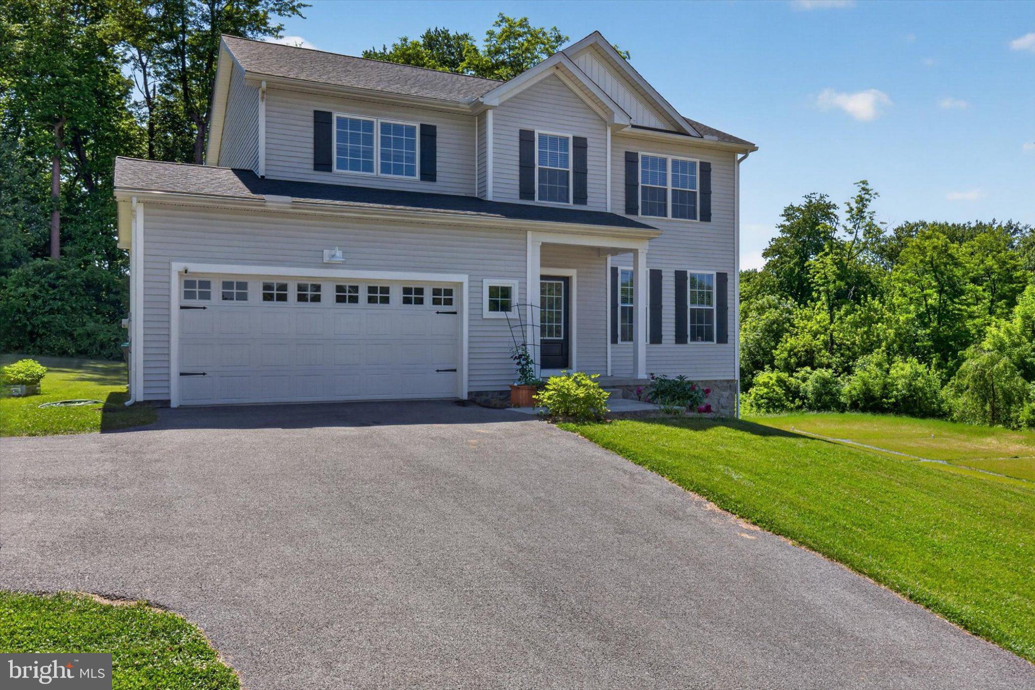 255 Kinneman Road Abbottstown, PA 17301 - Photo 2 of 39 Charming home with lush greenery backdrop.