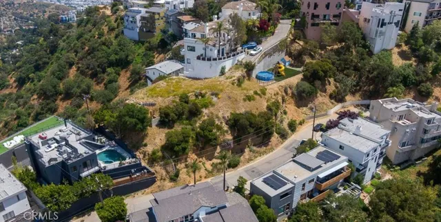 an aerial view of residential house with outdoor space