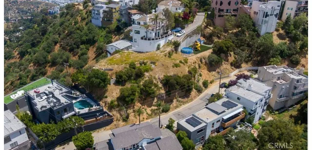 an aerial view of residential house with outdoor space and trees