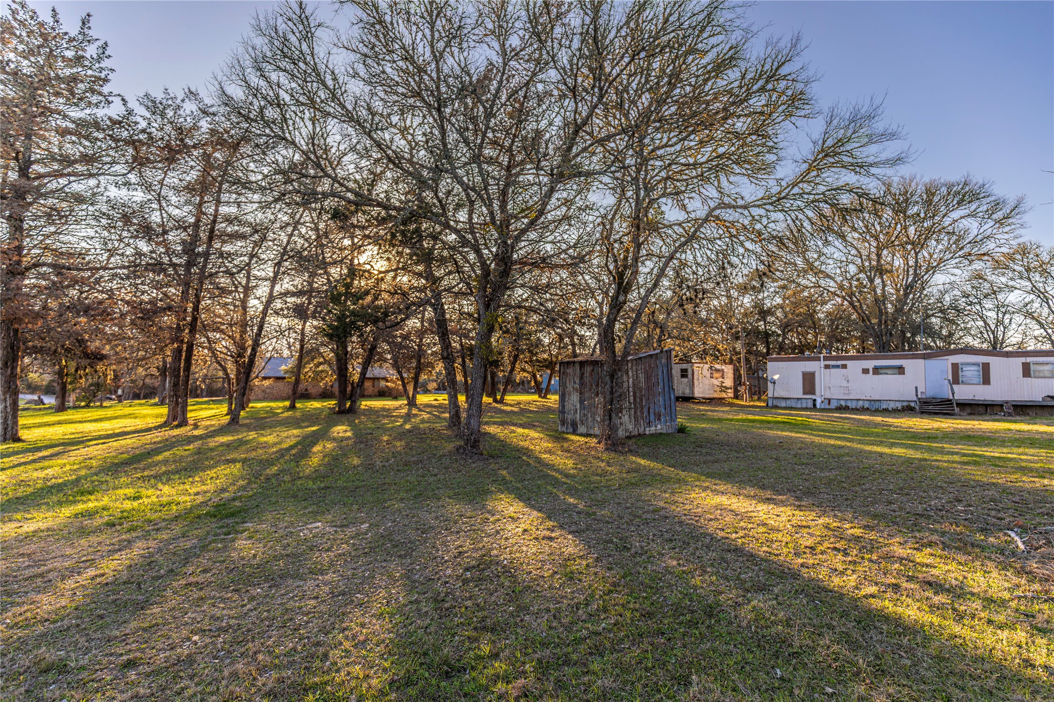 125 Forrest Lane Brenham, TX 77833 - Photo 17 of 21 a swimming pool with trees in front of it