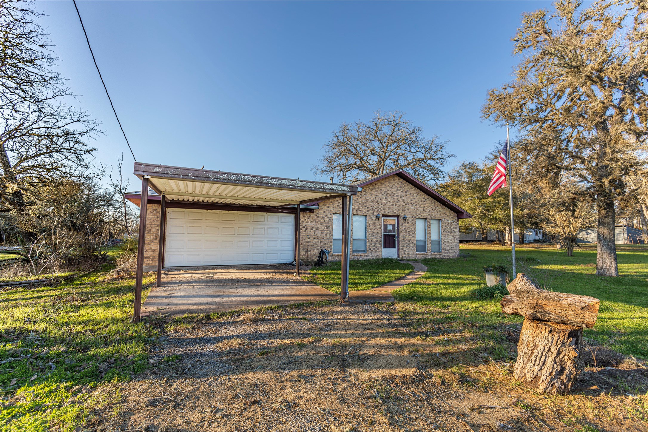 125 Forrest Lane Brenham, TX 77833 - Photo 3 of 21 a small house in middle of the green field