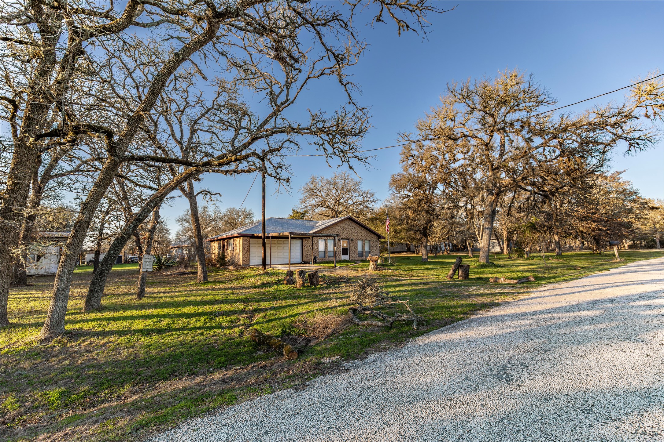 125 Forrest Lane Brenham, TX 77833 - Photo 4 of 21 a front view of a house with a yard