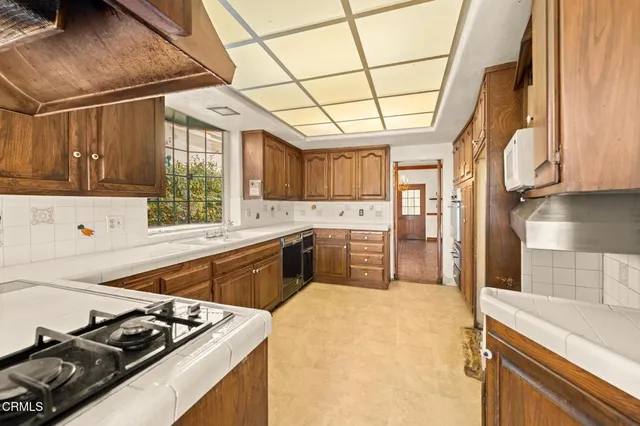 a view of a big room with wooden floor and stairs