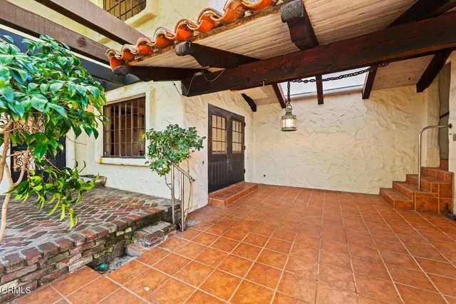 a view of an entryway with wooden floor and a livingroom view