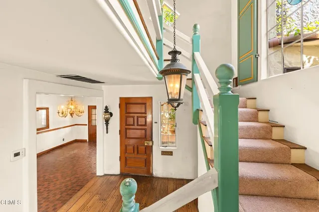 a view of a livingroom with an empty space and a fireplace