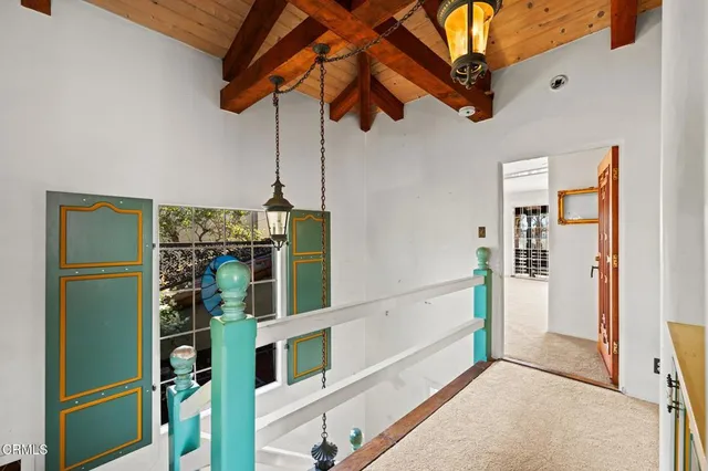 a view of a livingroom with an empty space and a fireplace