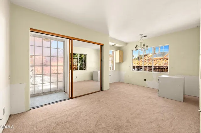 a view of a kitchen with wooden floor