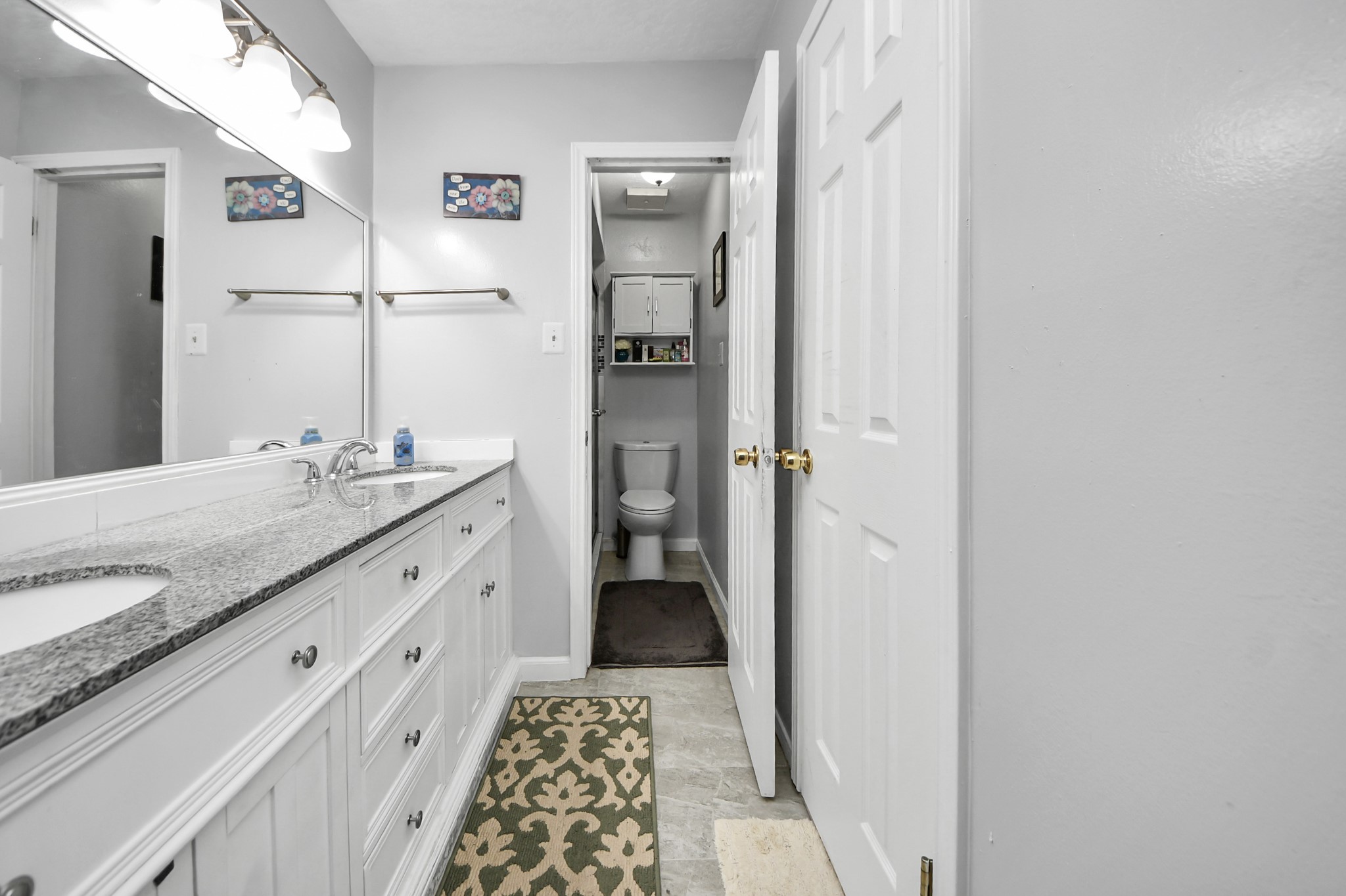 4155 Amir Street Houston, TX 77072 - Photo 40 of 43 a bathroom with a granite countertop sink and a mirror