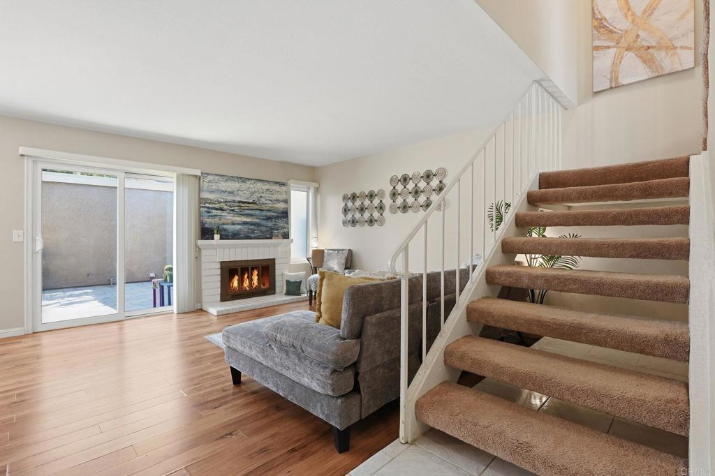 17 Cheyenne, Unit 64 Irvine, CA 92604 - Photo 11 of 33 a living room with furniture and a fireplace