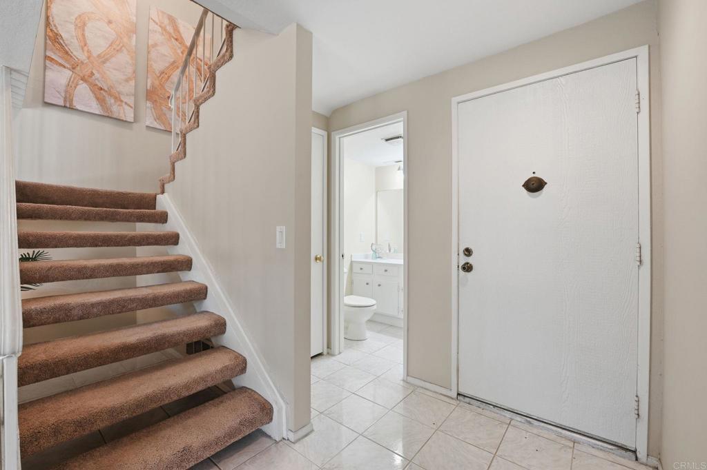 17 Cheyenne, Unit 64 Irvine, CA 92604 - Photo 12 of 33 a view of entryway and bathroom with a bathtub