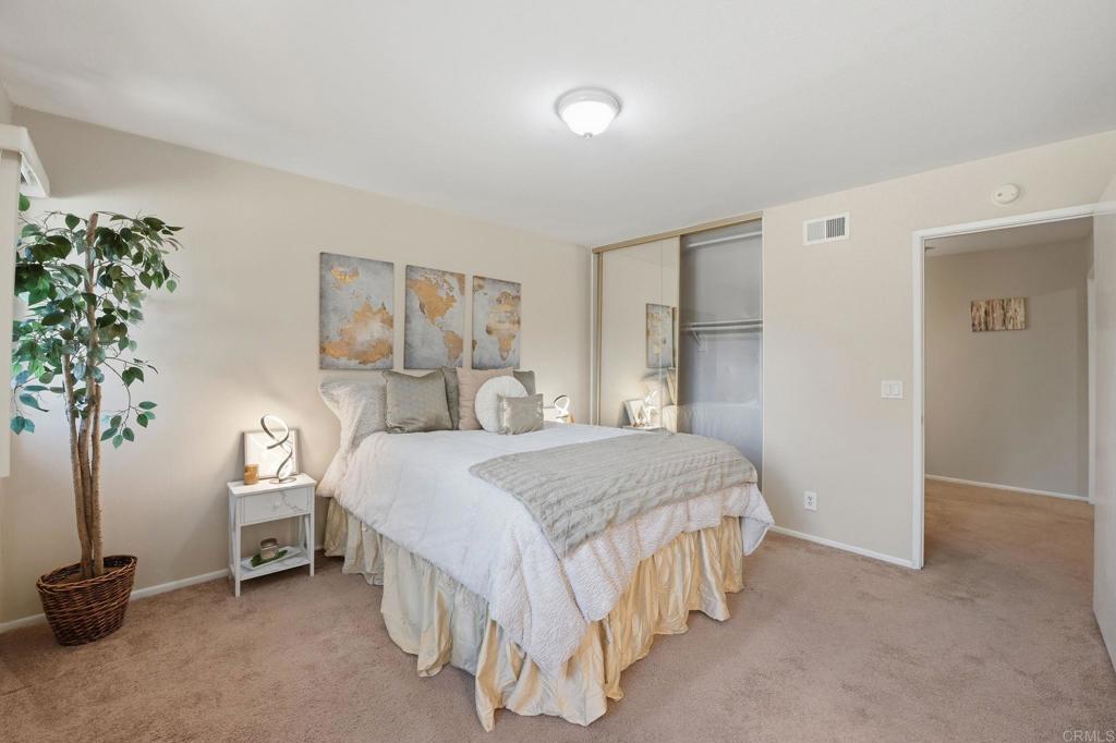 17 Cheyenne, Unit 64 Irvine, CA 92604 - Photo 18 of 33 a bedroom with a bed and a potted plant