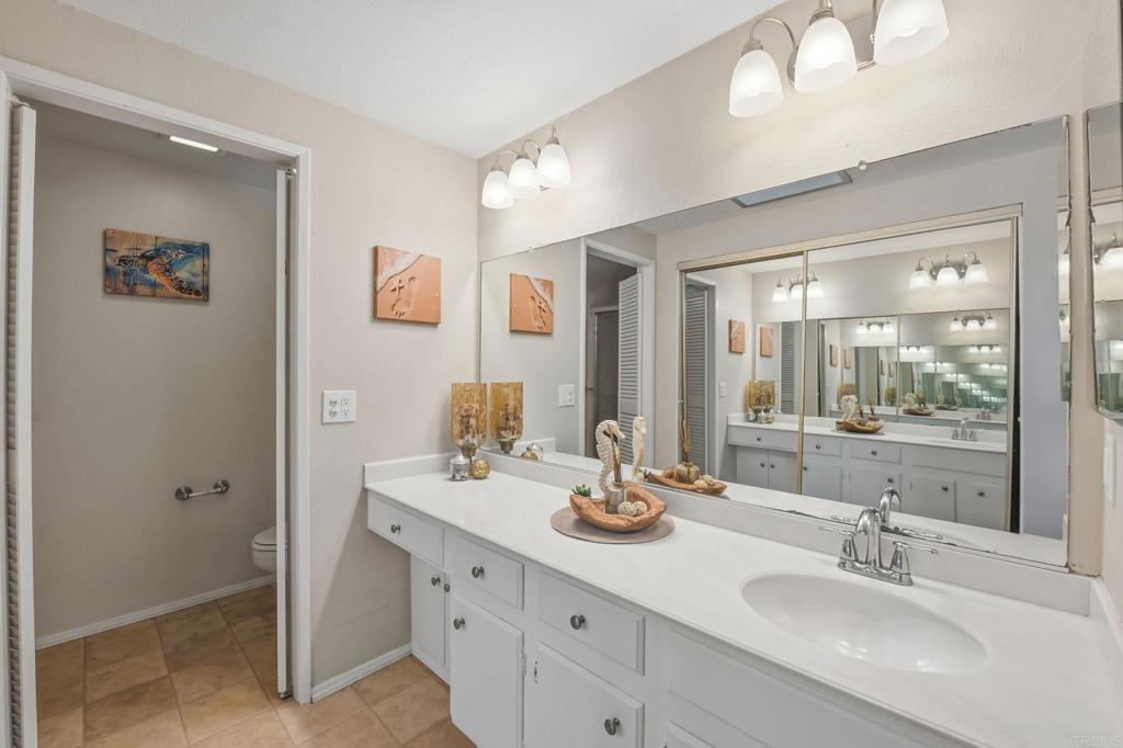 17 Cheyenne, Unit 64 Irvine, CA 92604 - Photo 19 of 33 a bathroom with a sink double vanity and a mirror