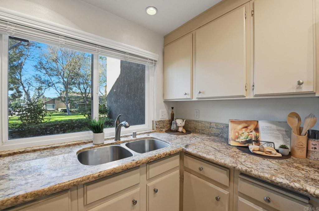 17 Cheyenne, Unit 64 Irvine, CA 92604 - Photo 8 of 33 a kitchen with granite countertop a sink a counter space and cabinets