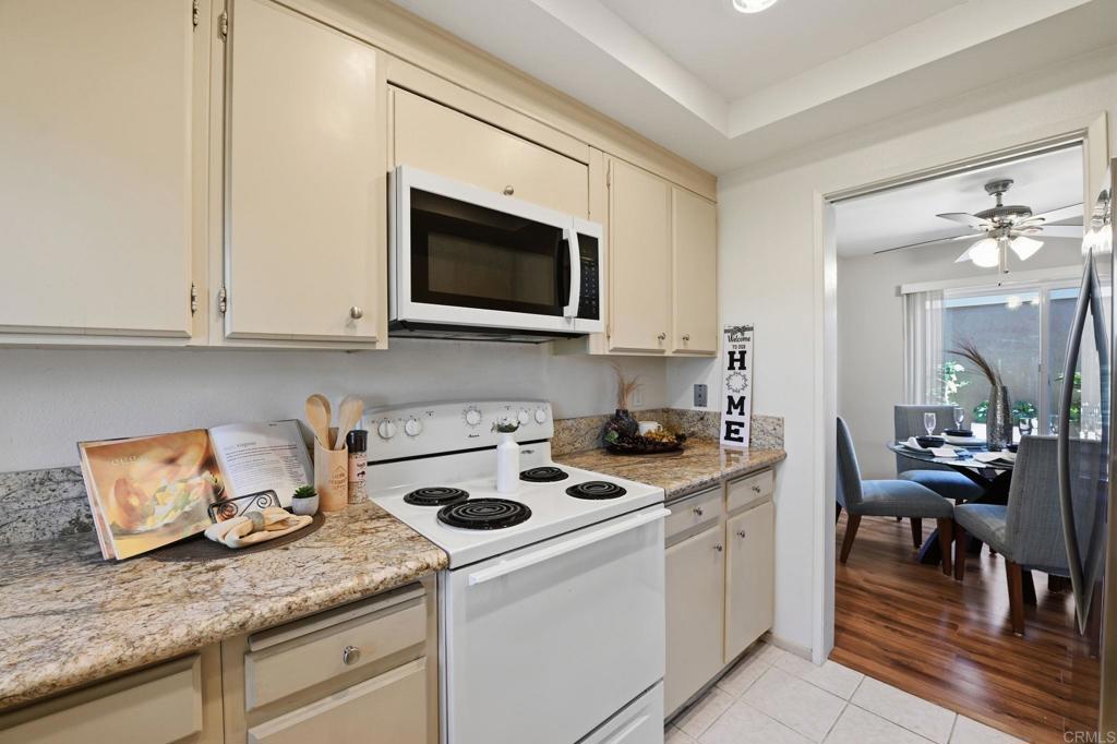 17 Cheyenne, Unit 64 Irvine, CA 92604 - Photo 10 of 33 a kitchen with stainless steel appliances granite countertop a sink stove and cabinets