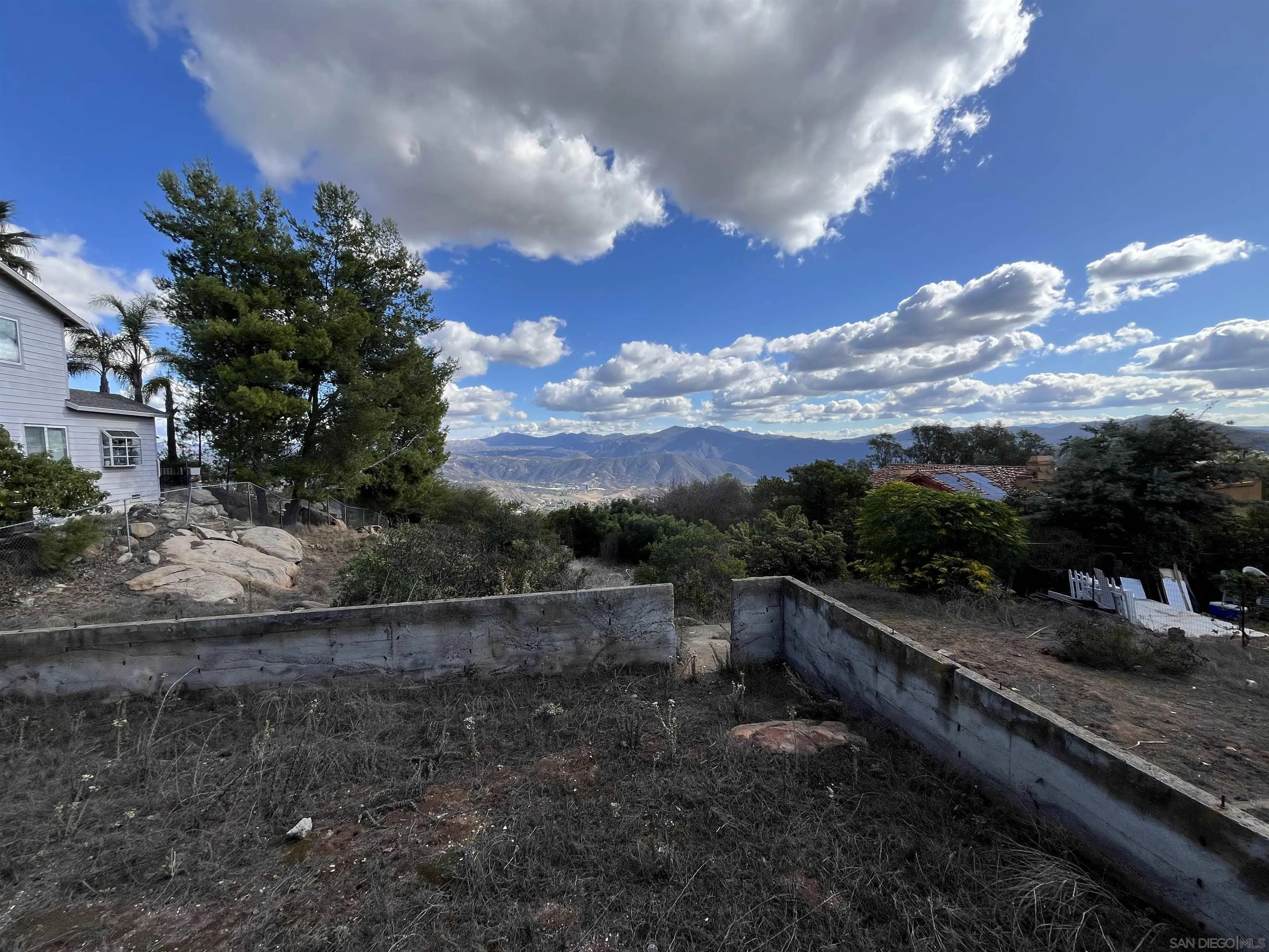 1828 Suncrest Boulevard, Unit 1828 El Cajon, CA 92021 - Photo 14 of 15 a view of a yard with wooden fence