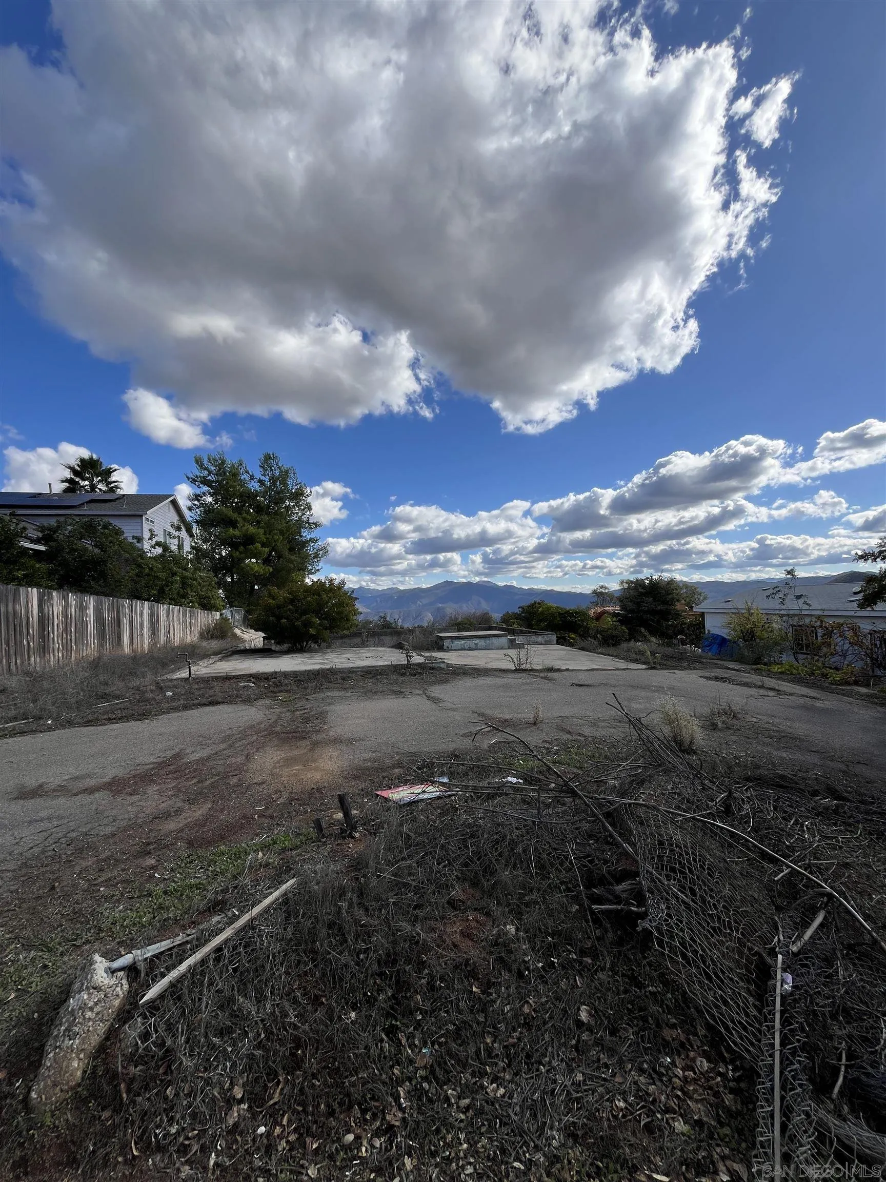 1828 Suncrest Boulevard, Unit 1828 El Cajon, CA 92021 - Photo 4 of 15 a view of a yard with wooden fence