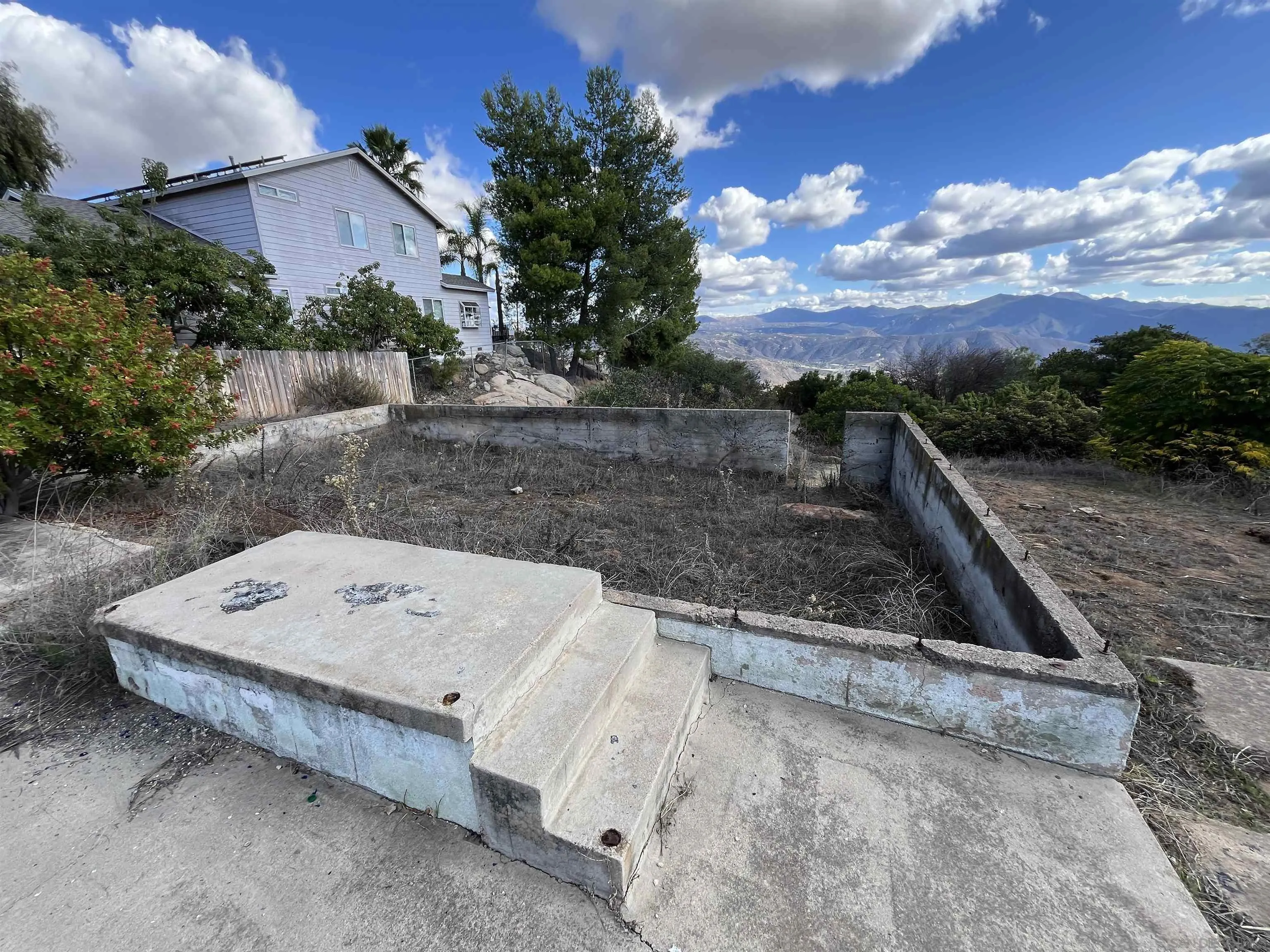 1828 Suncrest Boulevard, Unit 1828 El Cajon, CA 92021 - Photo 8 of 15 a view of a backyard with a sitting area