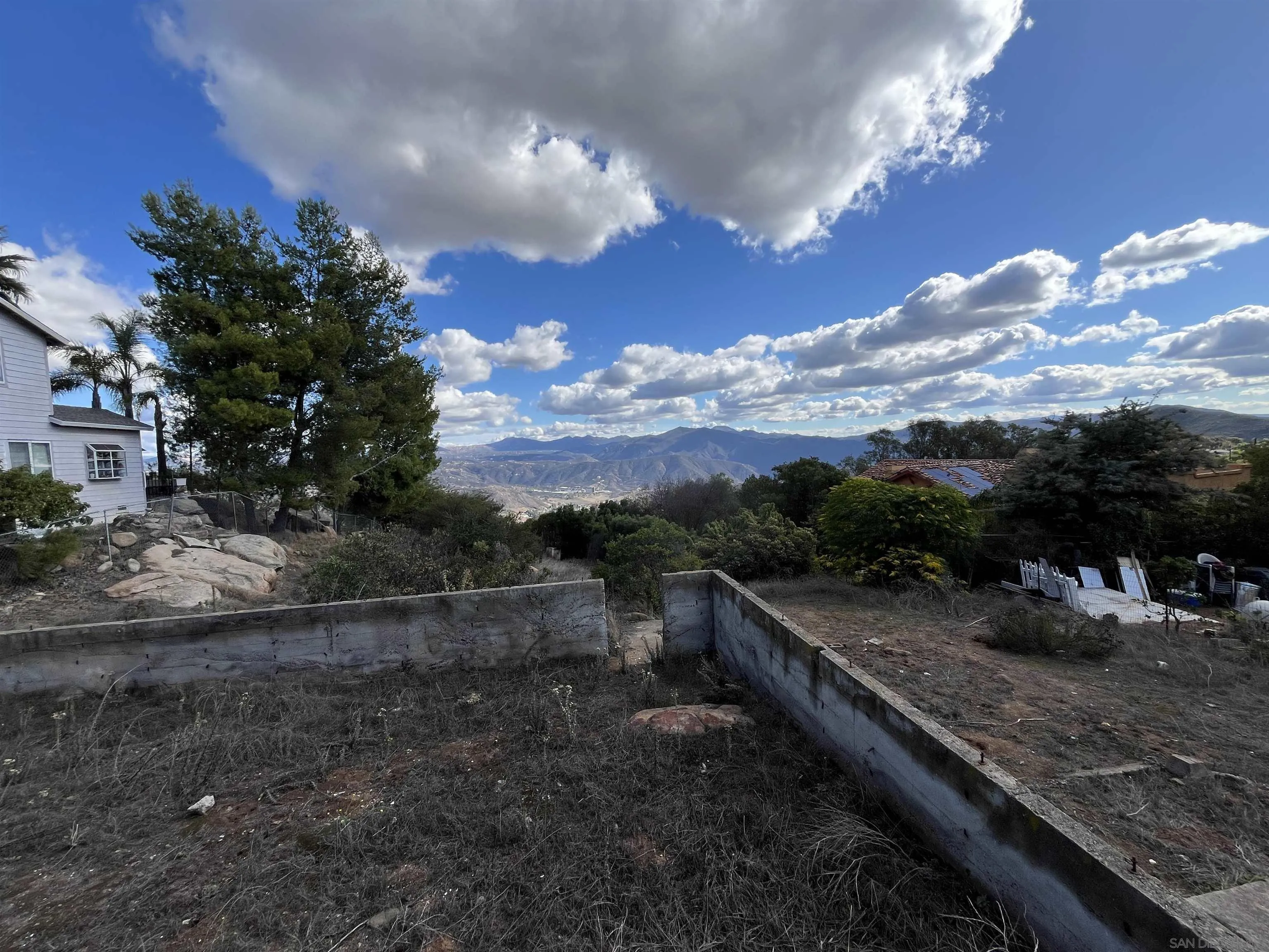 1828 Suncrest Boulevard, Unit 1828 El Cajon, CA 92021 - Photo 10 of 15 a view of a yard with wooden fence