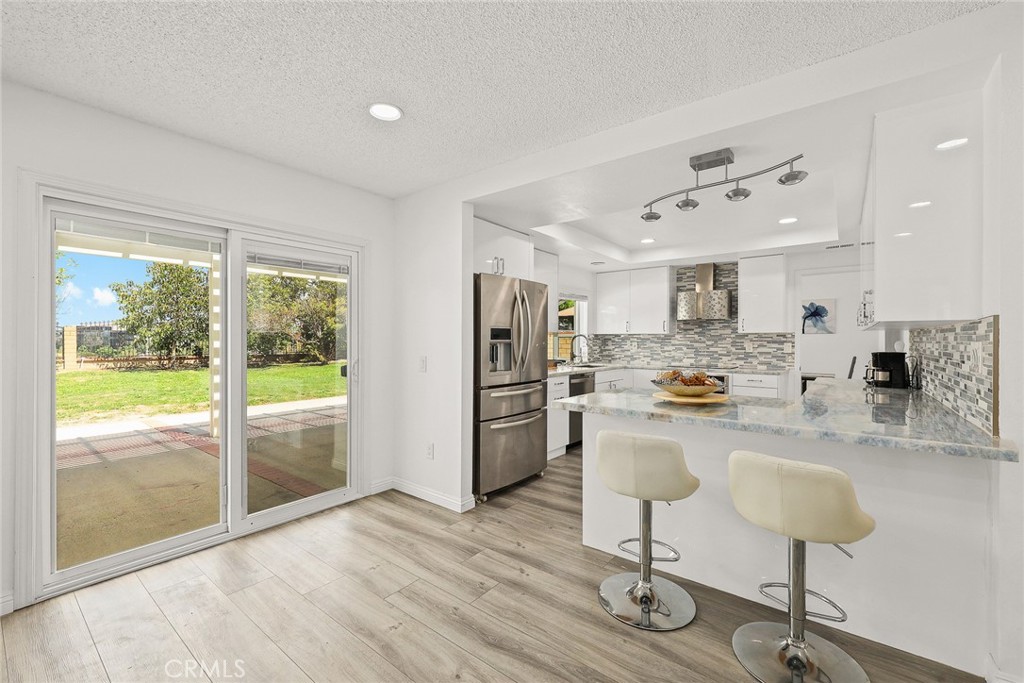 17845 Calle Barcelona Rowland Heights, CA 91748 - Photo 11 of 45 a kitchen with stainless steel appliances granite countertop a refrigerator and a stove top oven