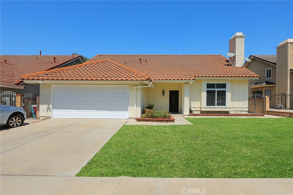 17845 Calle Barcelona Rowland Heights, CA 91748 - Photo 2 of 45 a front view of a house with a garden and yard