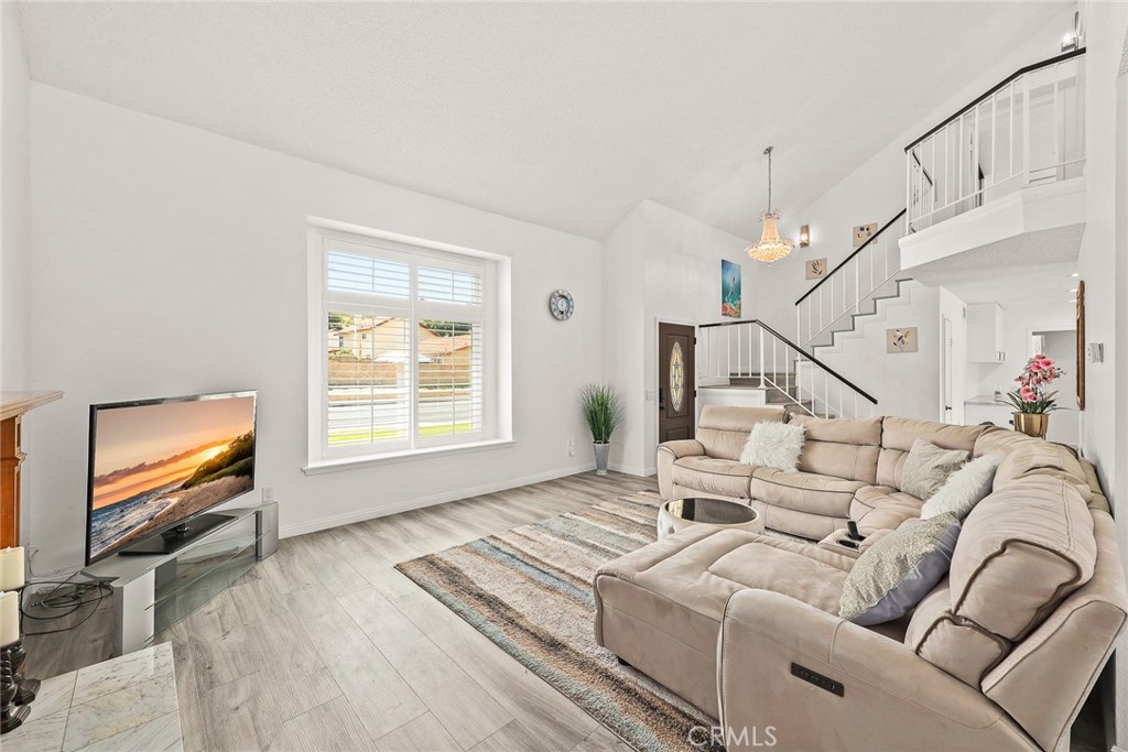 17845 Calle Barcelona Rowland Heights, CA 91748 - Photo 3 of 45 a living room with furniture and a flat screen tv