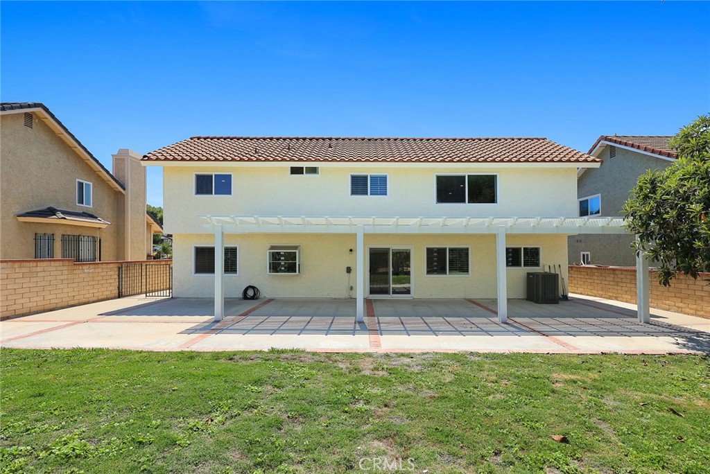 17845 Calle Barcelona Rowland Heights, CA 91748 - Photo 34 of 45 a backyard of a house with yard and outdoor seating