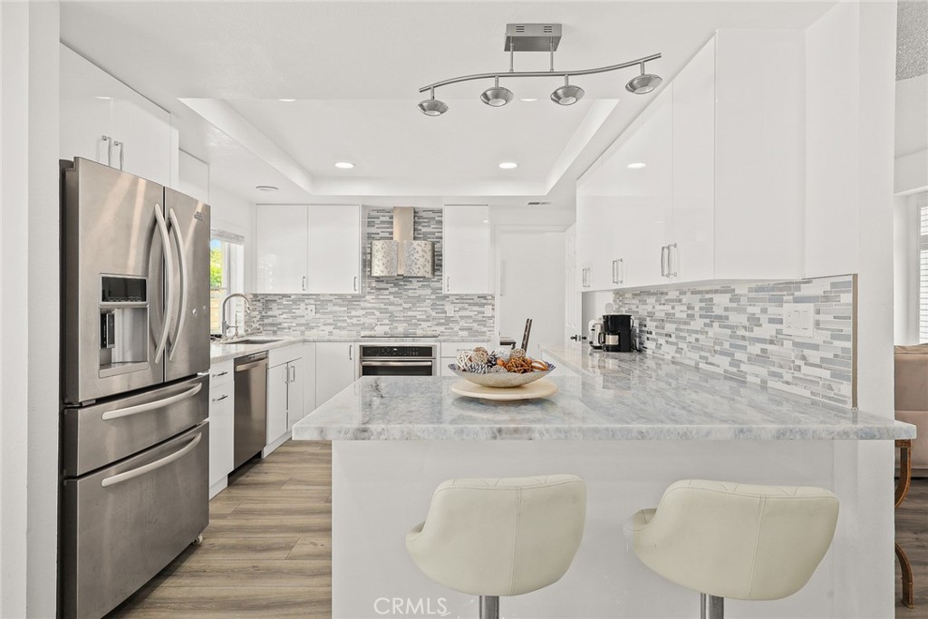 17845 Calle Barcelona Rowland Heights, CA 91748 - Photo 10 of 45 a kitchen with stainless steel appliances granite countertop a sink refrigerator stove and microwave