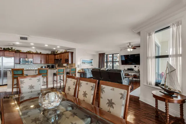 a view of a dining room with furniture and wooden floor
