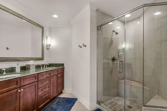 a living room with furniture large windows and a flat screen tv