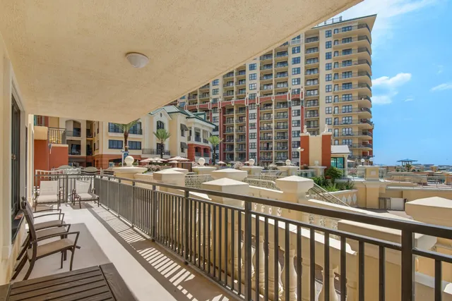 a view of a chairs and table in patio