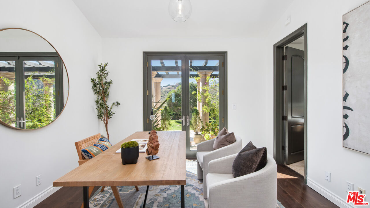 27311 Winding Way Malibu, CA 90265 - Photo 47 of 73 a view of a dining room with furniture window and wooden floor