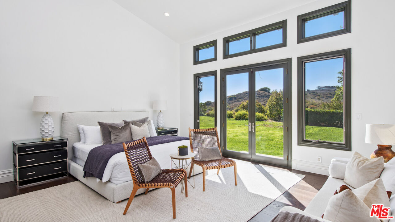 27311 Winding Way Malibu, CA 90265 - Photo 51 of 73 a bed room with a bed and a chair