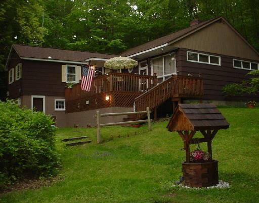 113 Georgetown Road Weston, CT 06883 - Photo 1 of 1 a front view of house with yard and green space