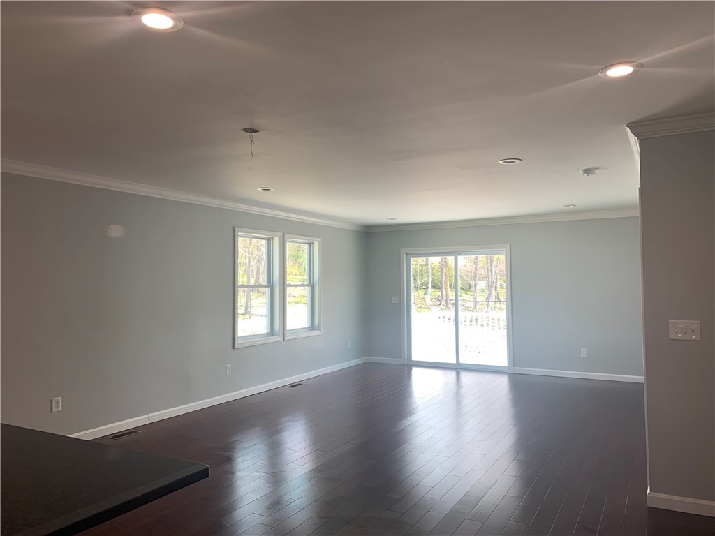 1520 Chopmist Hill Road, Unit 10 Scituate, RI 02857 - Photo 3 of 9 Dining &. Living room with slider door to a 10x12 Deck