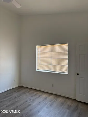 a view of a room with wooden floor