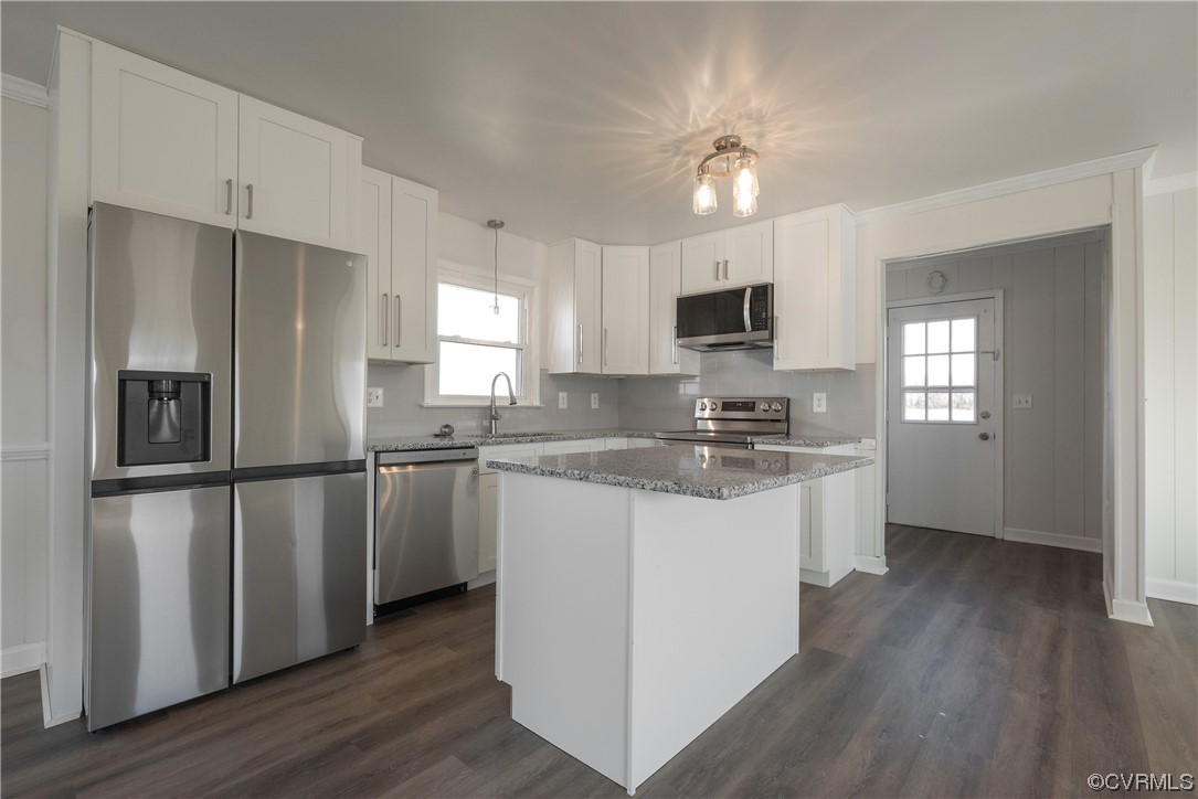 320 Courtney Road Lancaster, VA 22503 - Photo 11 of 43 a kitchen with a refrigerator cabinets and wooden floor