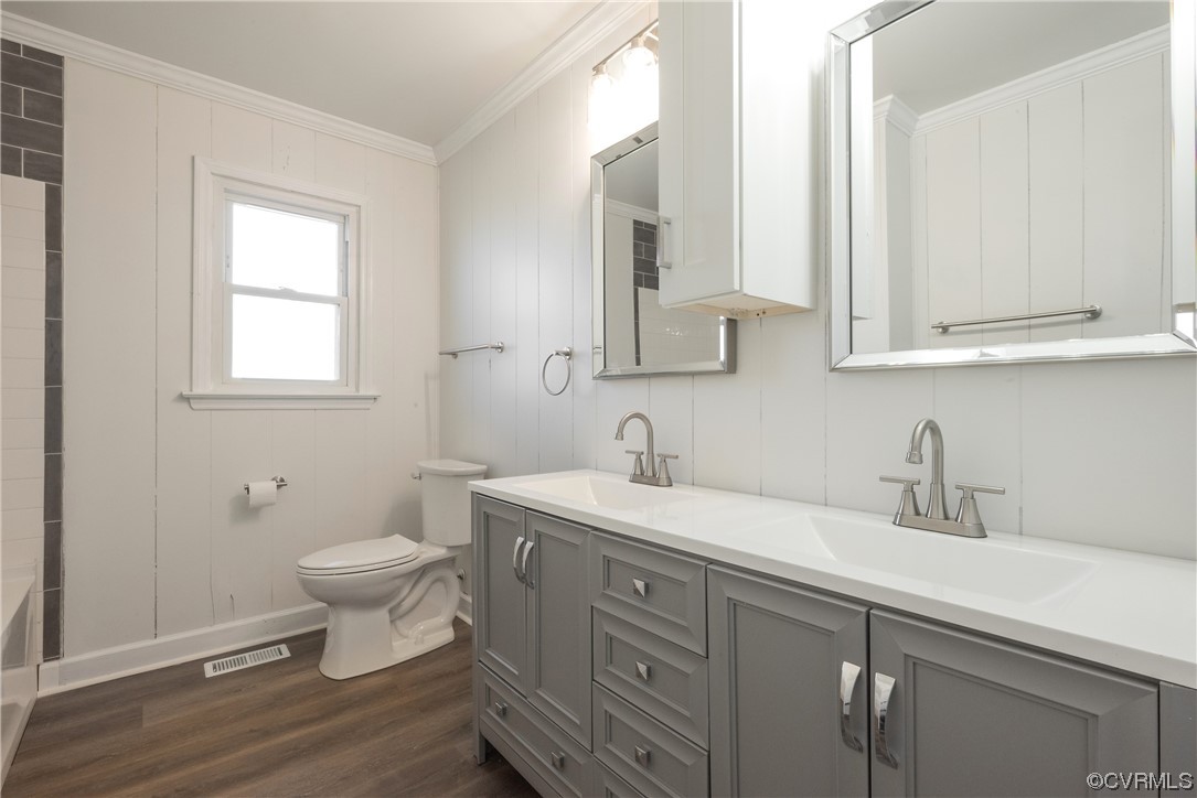 320 Courtney Road Lancaster, VA 22503 - Photo 22 of 43 a bathroom with a toilet sink and mirror