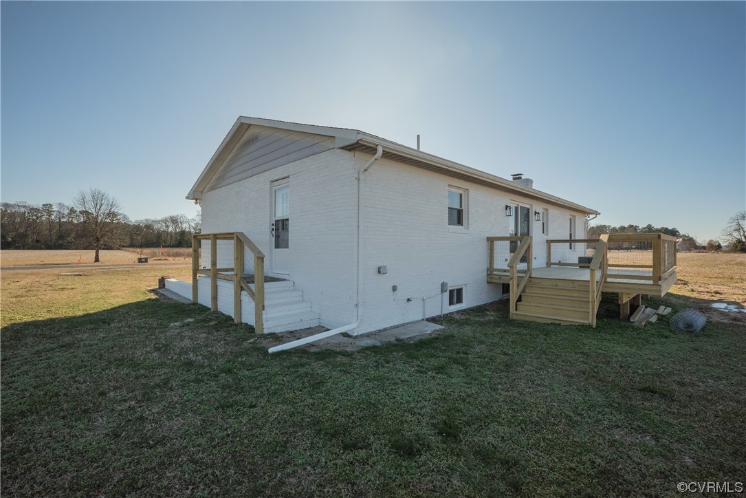 320 Courtney Road Lancaster, VA 22503 - Photo 33 of 43 a view of a house with backyard