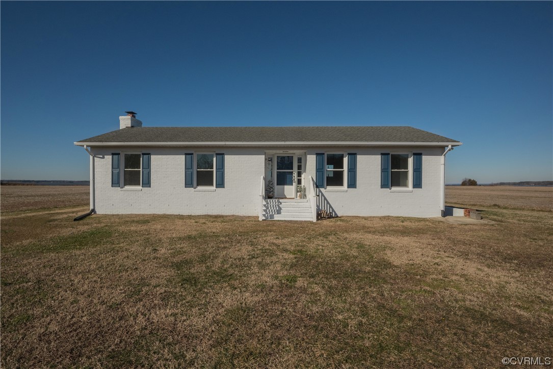 320 Courtney Road Lancaster, VA 22503 - Photo 41 of 43 a front view of a house with a garden