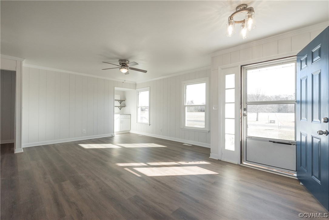 320 Courtney Road Lancaster, VA 22503 - Photo 6 of 43 an empty room with wooden floor and windows