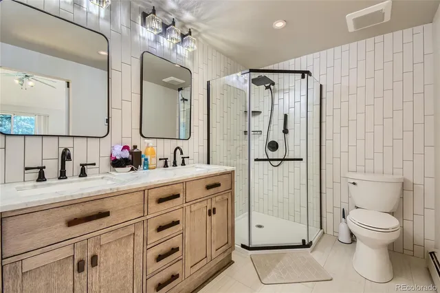 a bathroom with a double vanity sink and a mirror