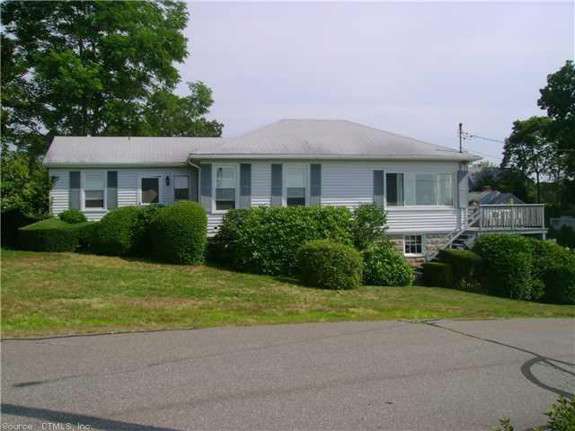 6 Ridgewood Road East Lyme, CT 06357 - Photo 1 of 1 a front view of a house with yard and green space