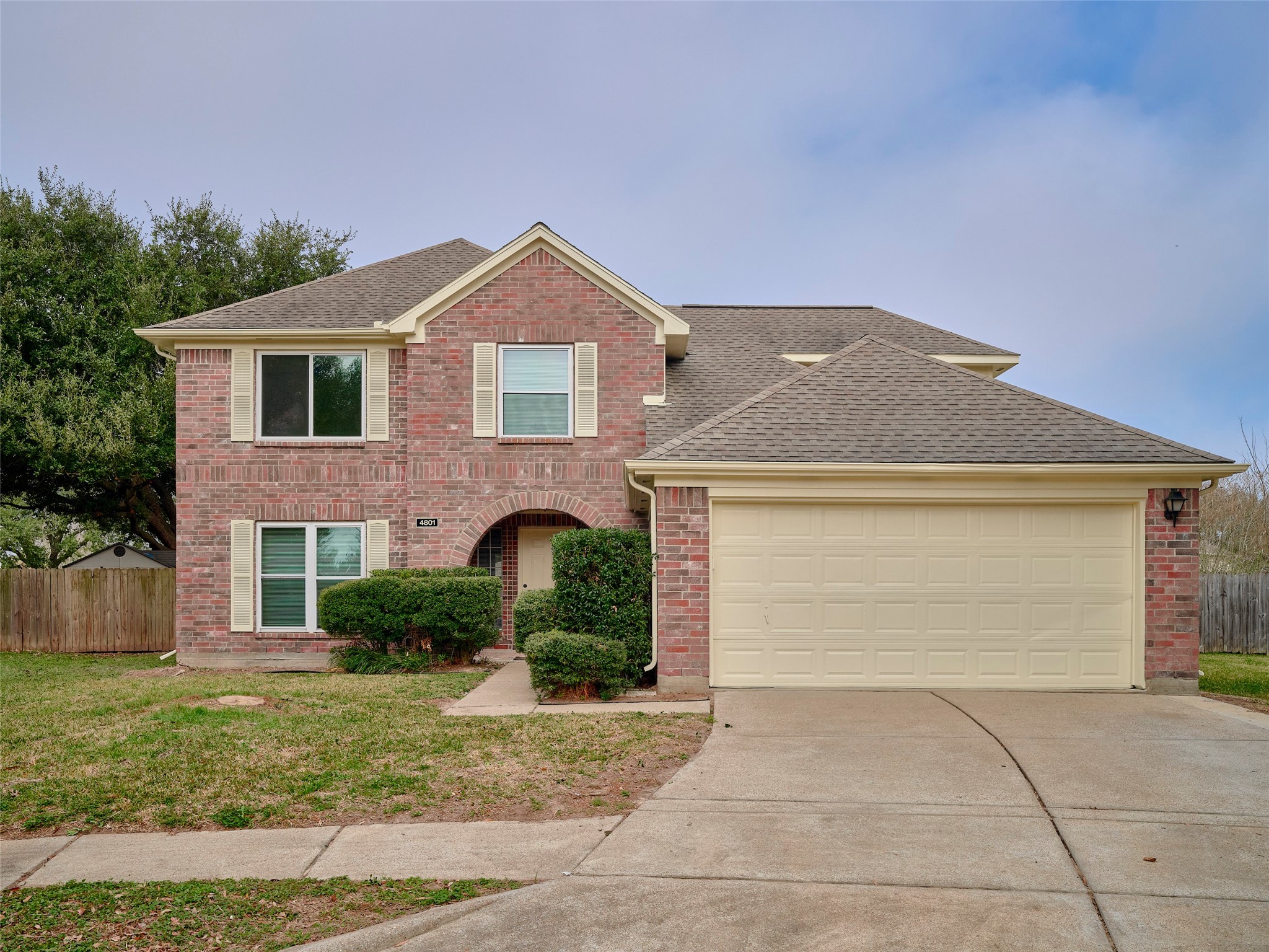 4801 East Columbary Drive Rosenberg, TX 77471 - Photo 1 of 50 a front view of a house with a yard and garage