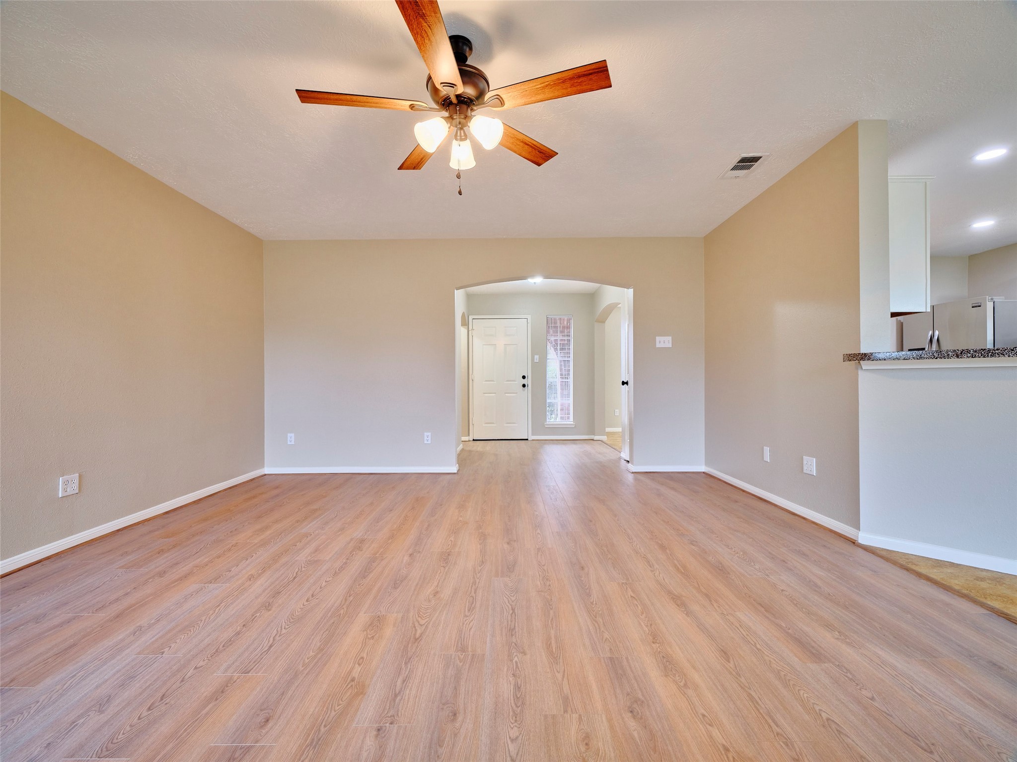 4801 East Columbary Drive Rosenberg, TX 77471 - Photo 13 of 50 wooden floor in an empty room with a window