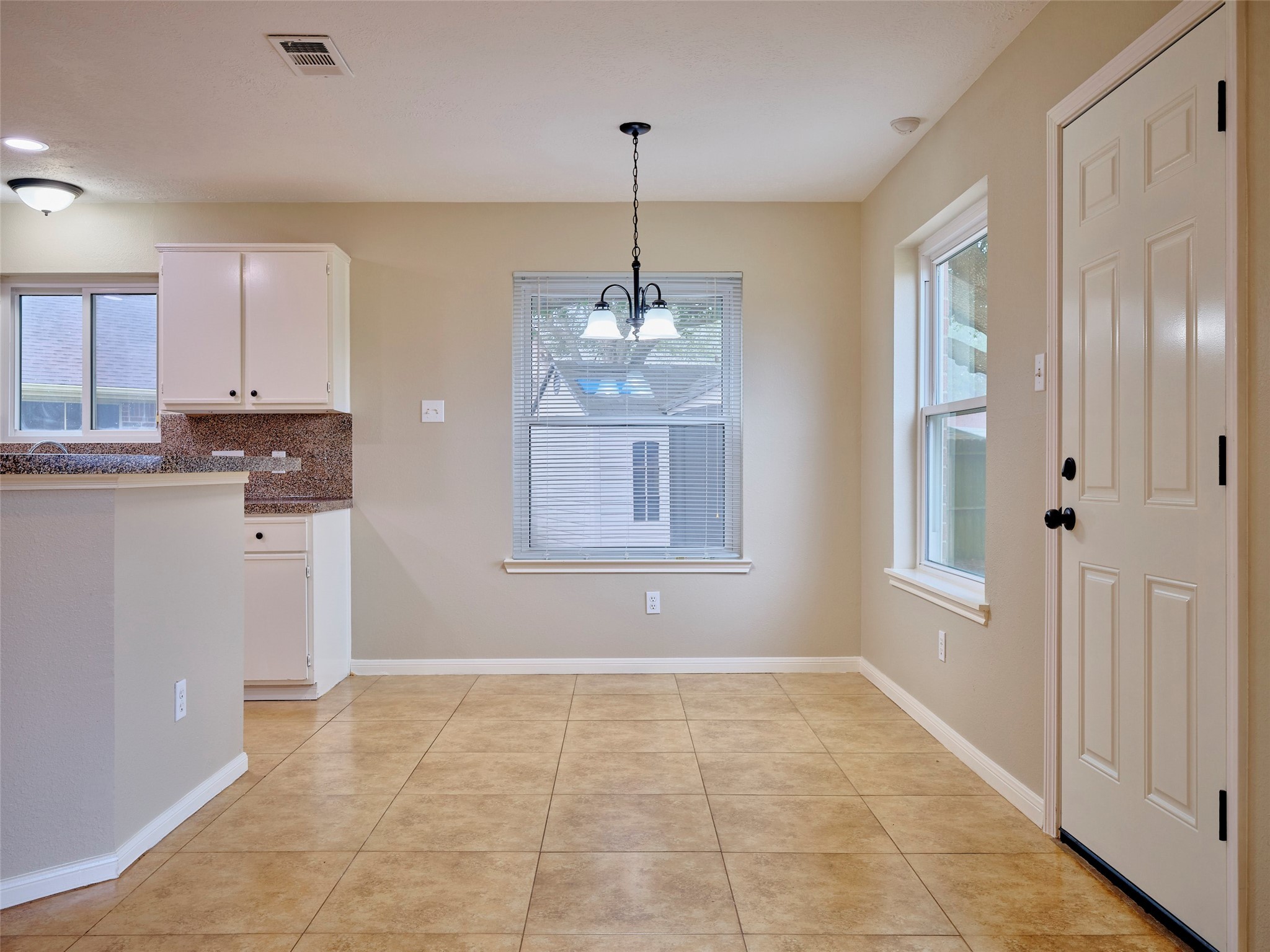 4801 East Columbary Drive Rosenberg, TX 77471 - Photo 18 of 50 a view of a kitchen with an empty space and window