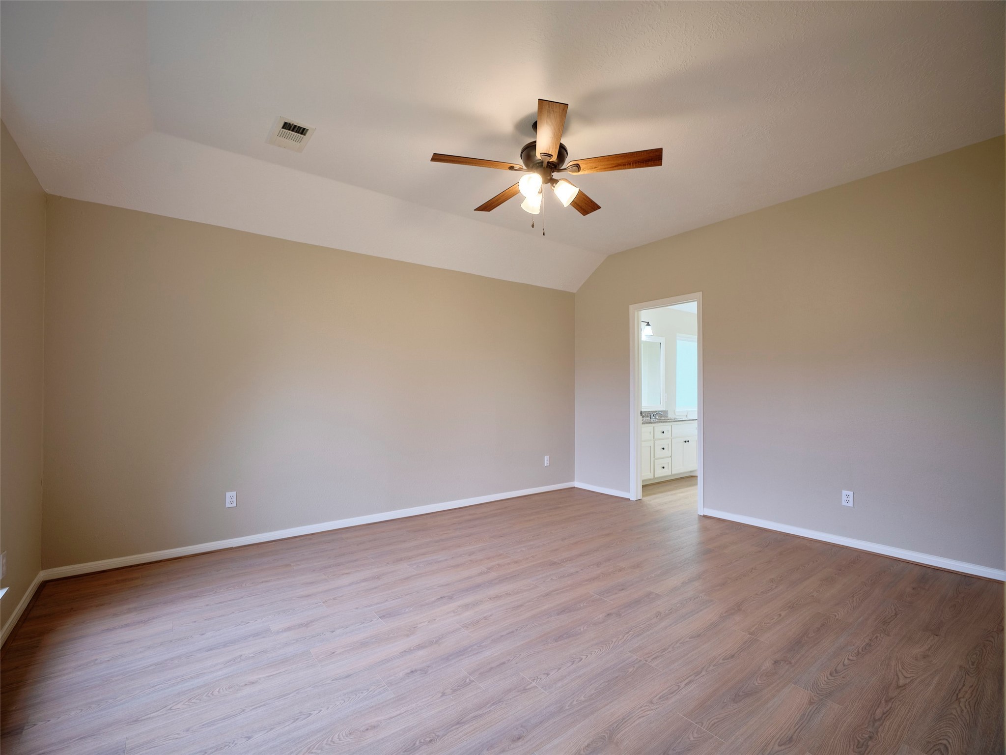 4801 East Columbary Drive Rosenberg, TX 77471 - Photo 19 of 50 a view of an empty room with wooden floor and a ceiling fan