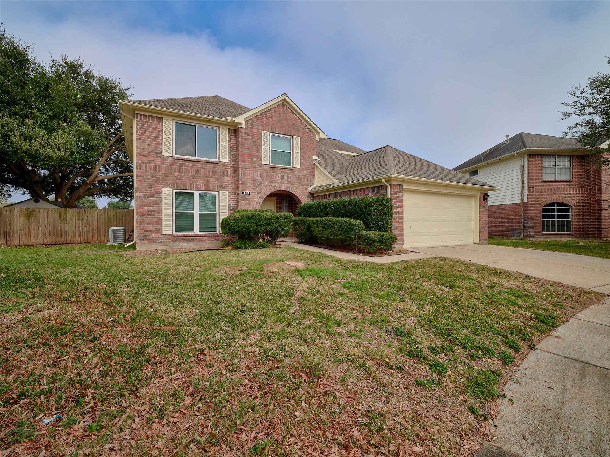 4801 East Columbary Drive Rosenberg, TX 77471 - Photo 2 of 50 a front view of a house with a yard and garage