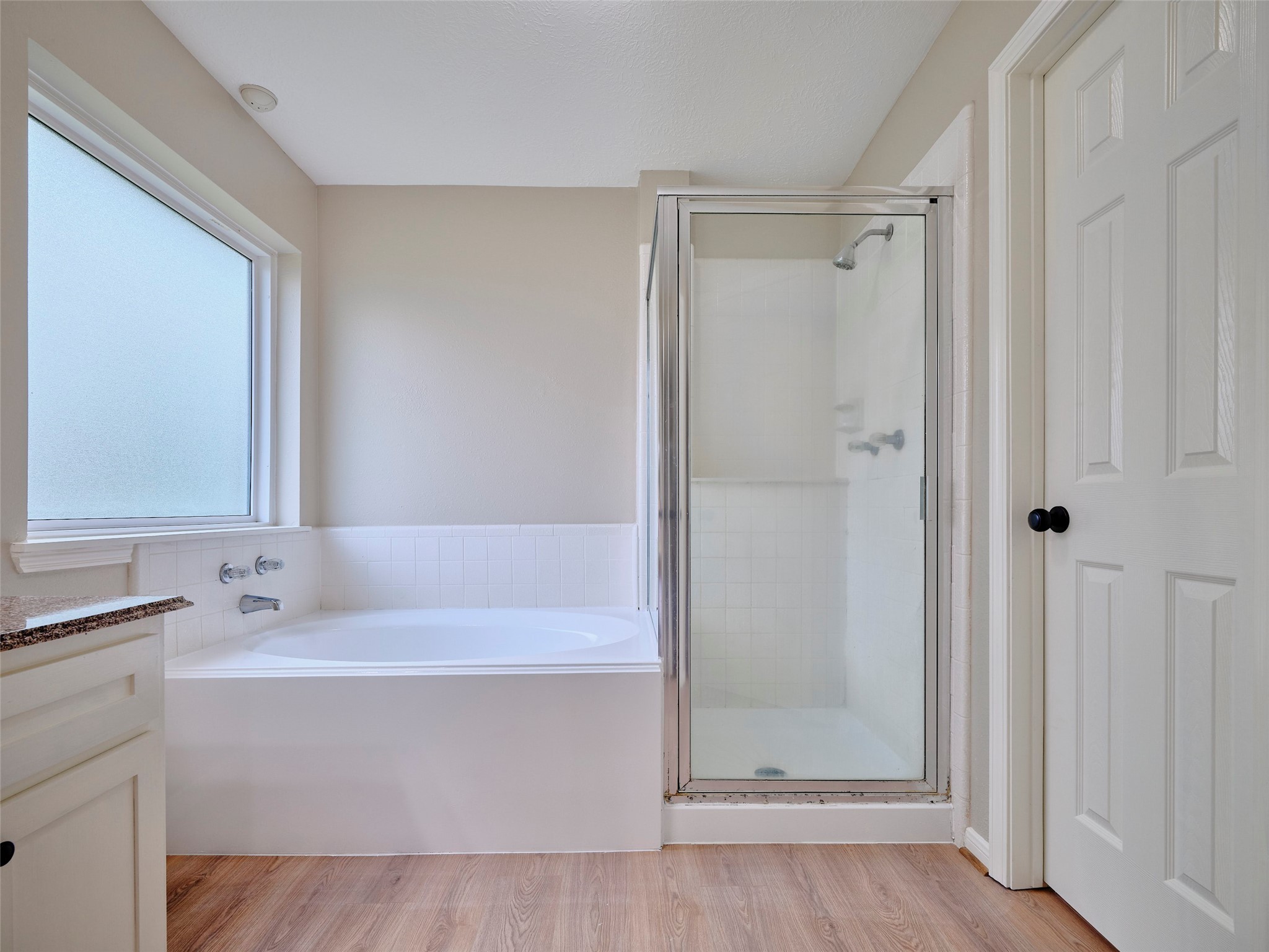 4801 East Columbary Drive Rosenberg, TX 77471 - Photo 24 of 50 a bathroom with a tub shower vanity and a sink