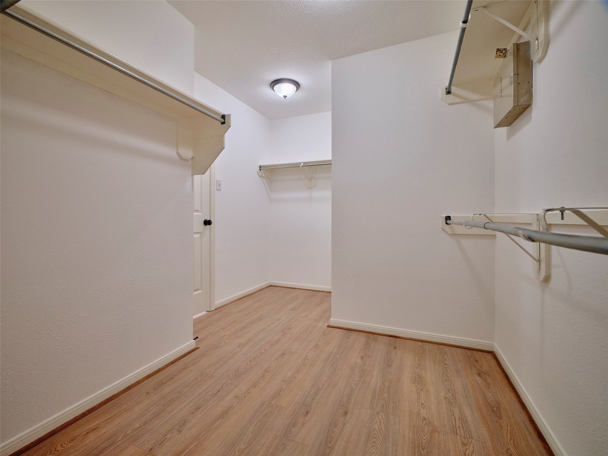 4801 East Columbary Drive Rosenberg, TX 77471 - Photo 28 of 50 a view of a room with wooden floor and white walls