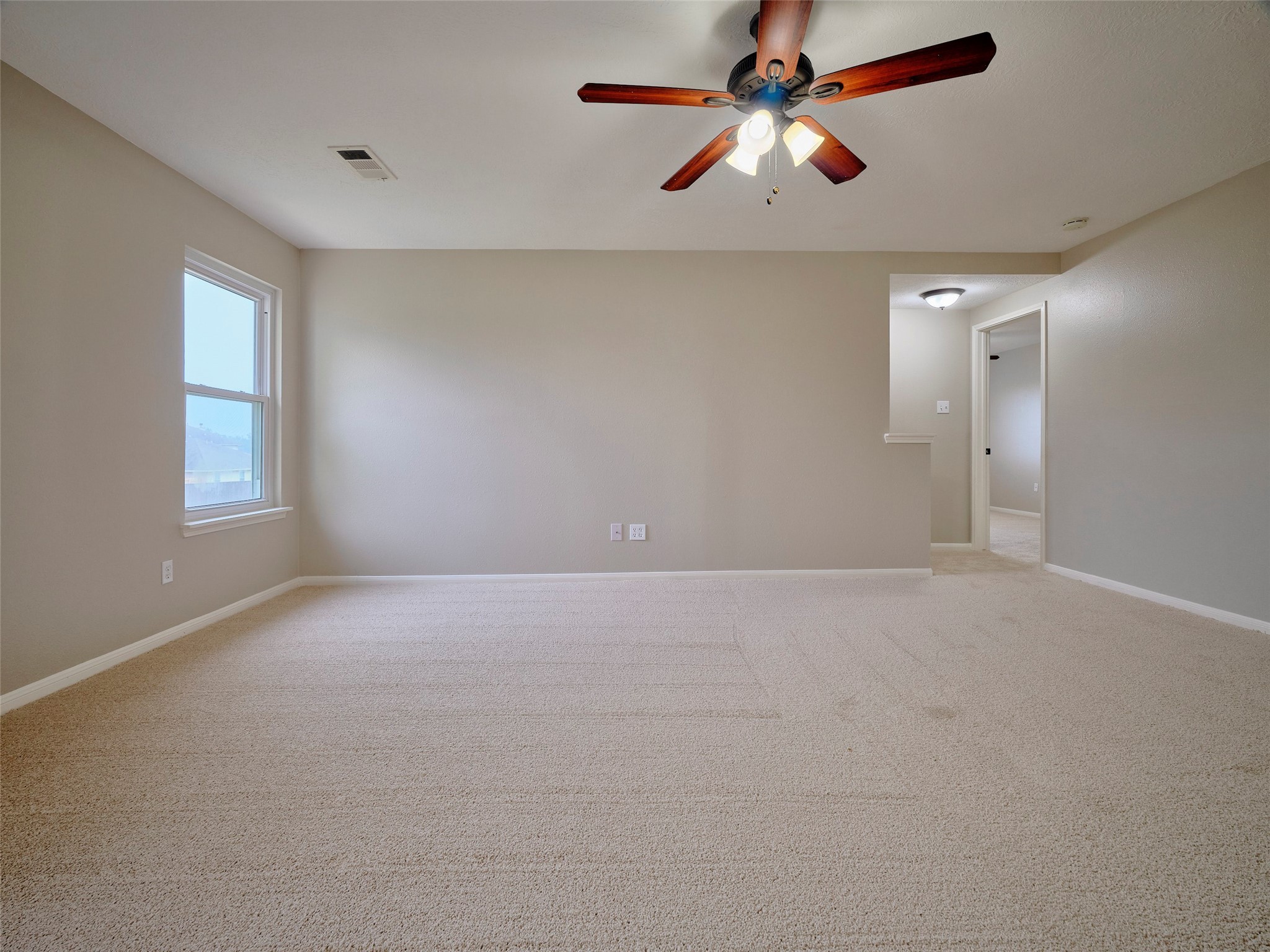 4801 East Columbary Drive Rosenberg, TX 77471 - Photo 32 of 50 a view of an empty room with a window